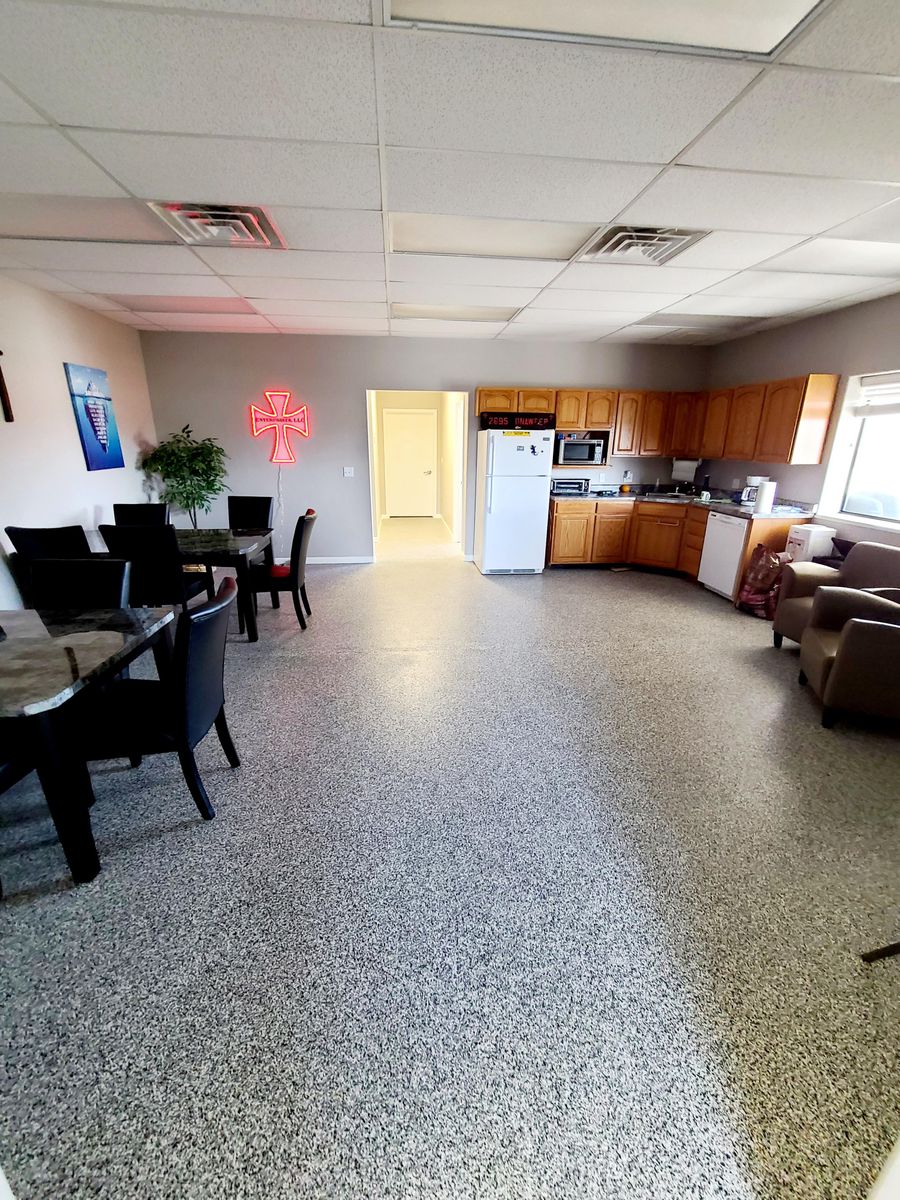 Office break room with a flake epoxy floor finished by Hoffmann&rsquo;s