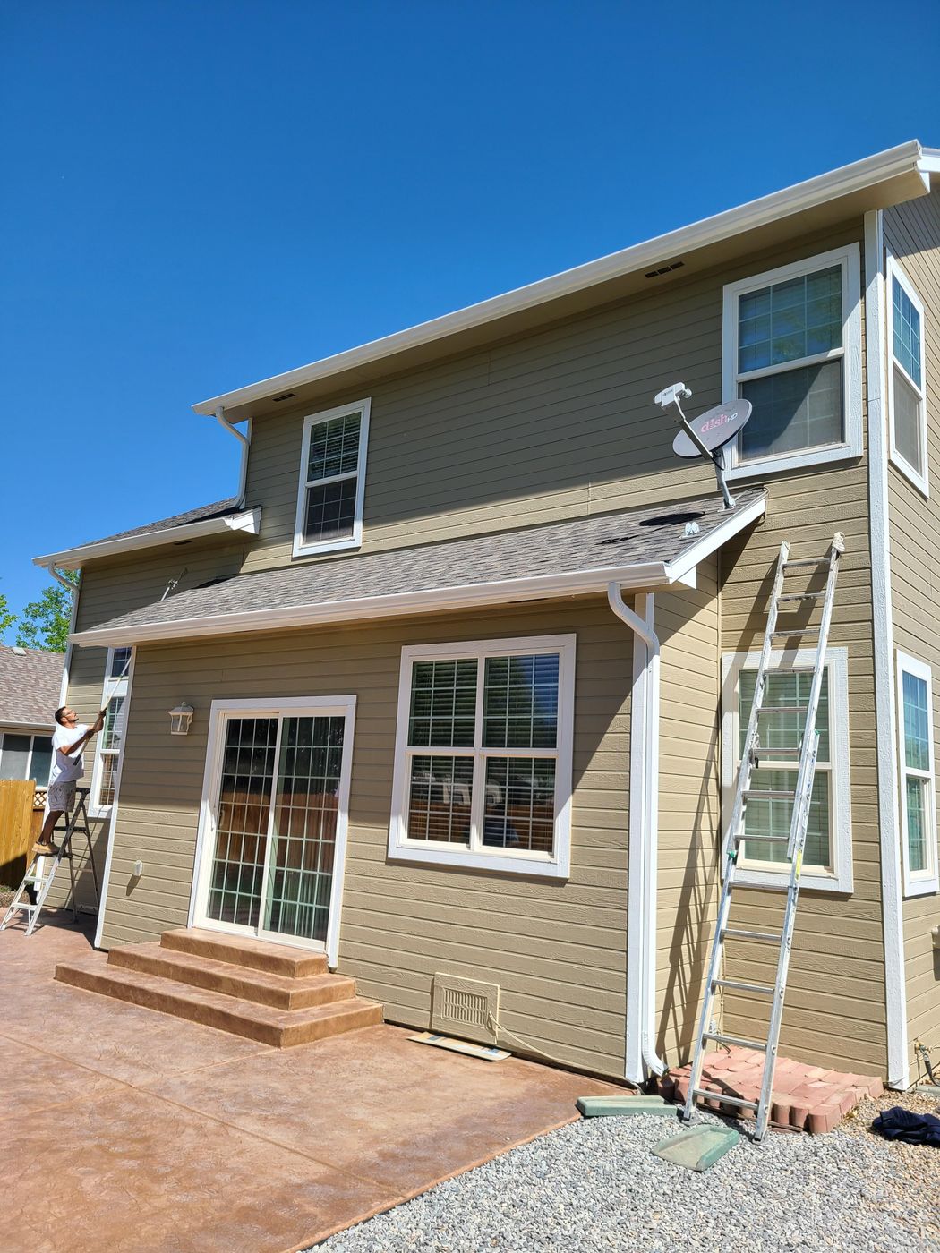 Two-story home with fresh exterior paint and white trim