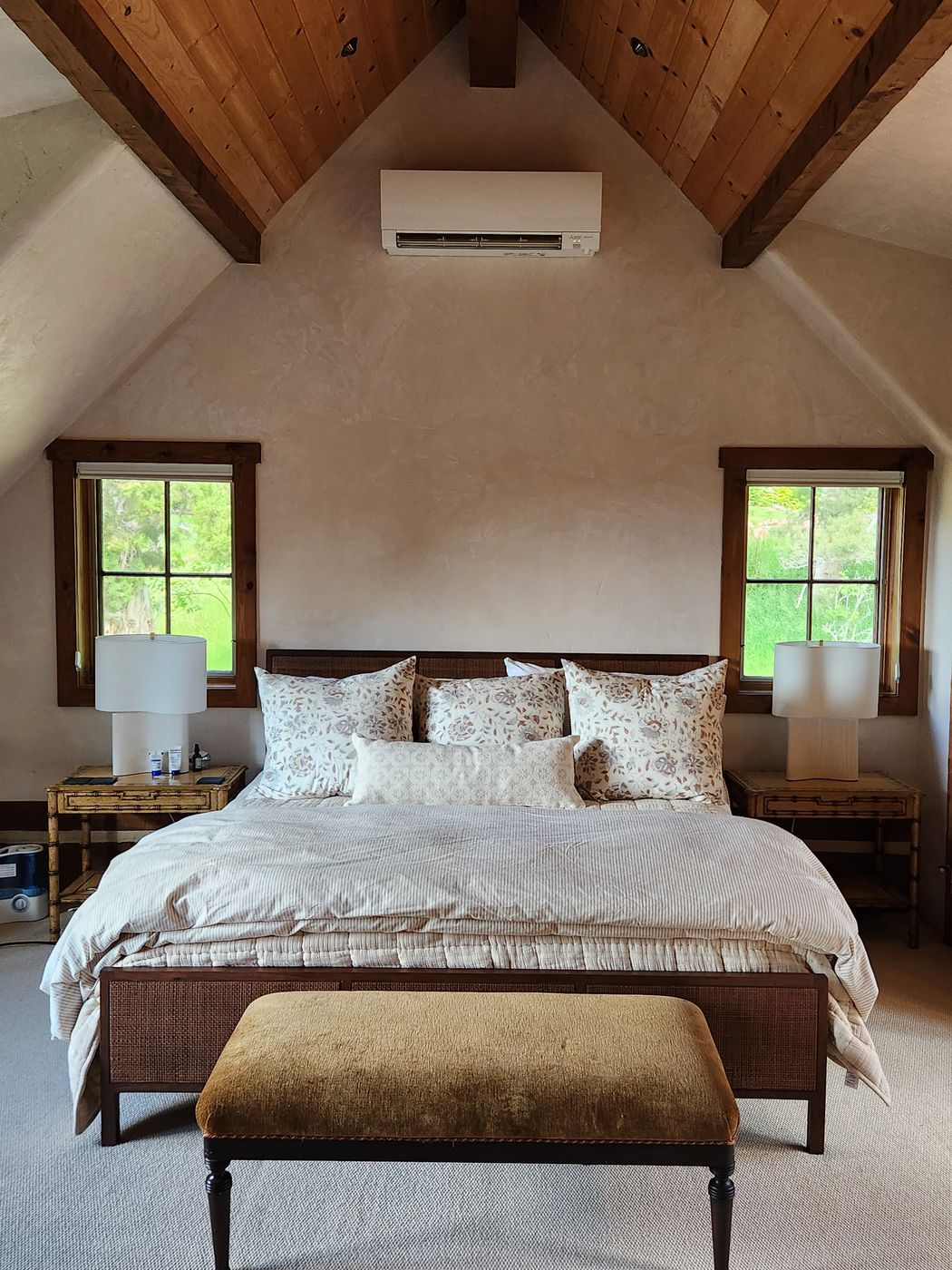Vaulted bedroom with a wall-mounted mini-split head
