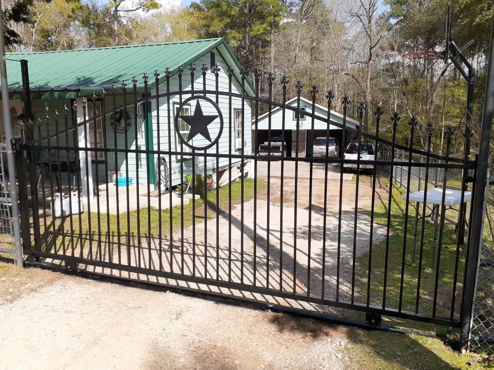 Wrought-iron double drive gate with a Texas star