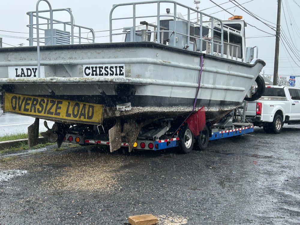LADY CHESSIE work boat on the trailer with an oversize load banner