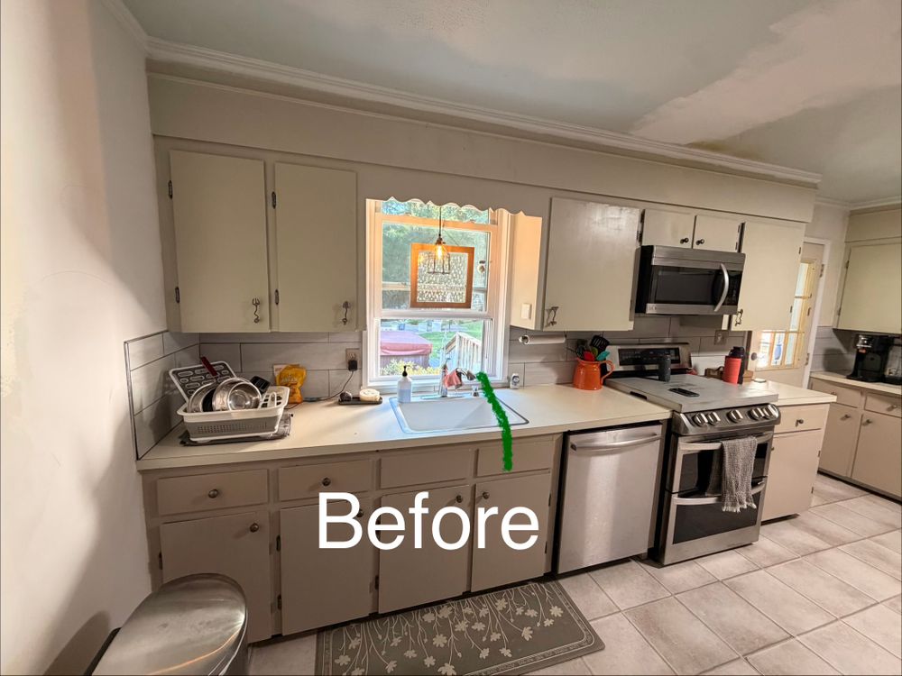 Kitchen with dated cabinets before painting