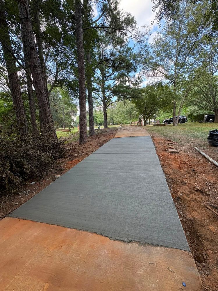 Replacement concrete walkway section poured through a wooded lot