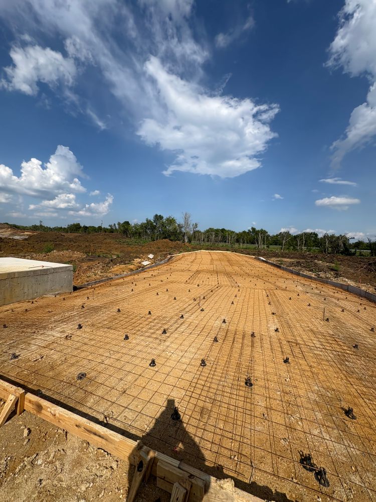 Rebar and wire mesh installed over a prepared subgrade