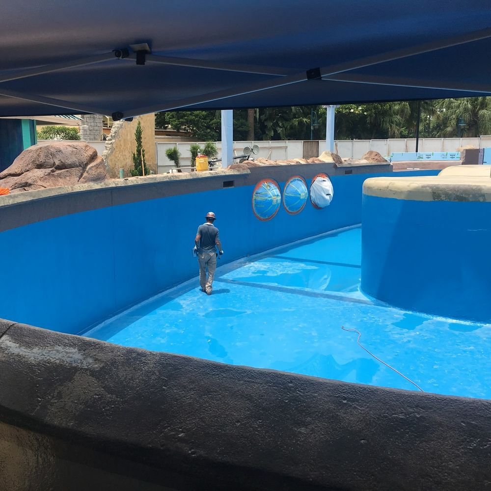 Recoated marine mammal habitat pool with a new blue coating system