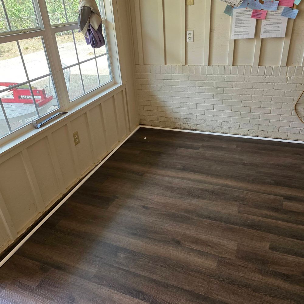 Newly installed wood-look flooring in a remodeled East Texas living room