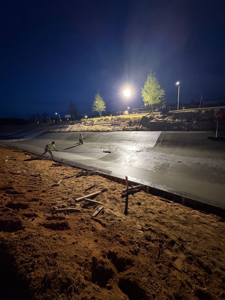 Night concrete pour under work lights on large flatwork