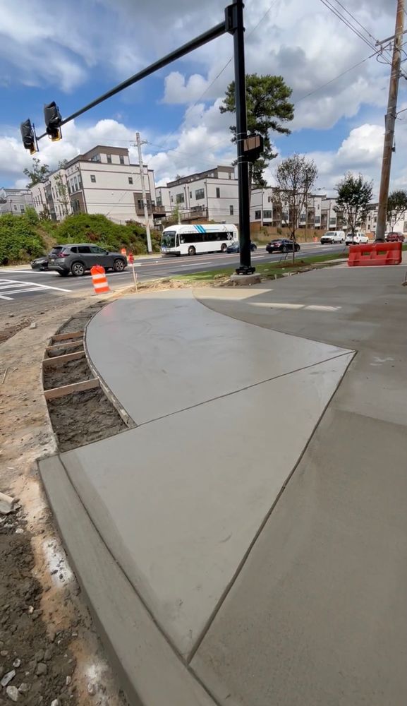 New concrete sidewalk and curb radius along a street