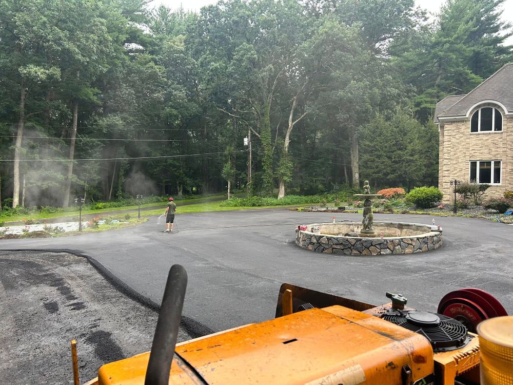 Our Asphalt Maintenance service ensures your driveway's longevity by filling cracks, sealing surfaces, and preventing damage. Protect your investment with routine care that enhances curb appeal and withstands harsh weather conditions. for Aldrich & Sons Asphalt Services in Lowell, MA