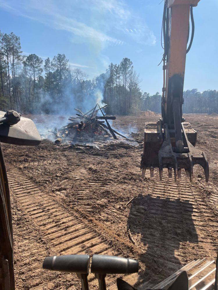 Our Land Clearing service efficiently removes trees, shrubs, and debris from your property to create a clean slate for your construction or remodeling project, ensuring a smooth and effective process. for Arnold Construction in Magnolia, TX