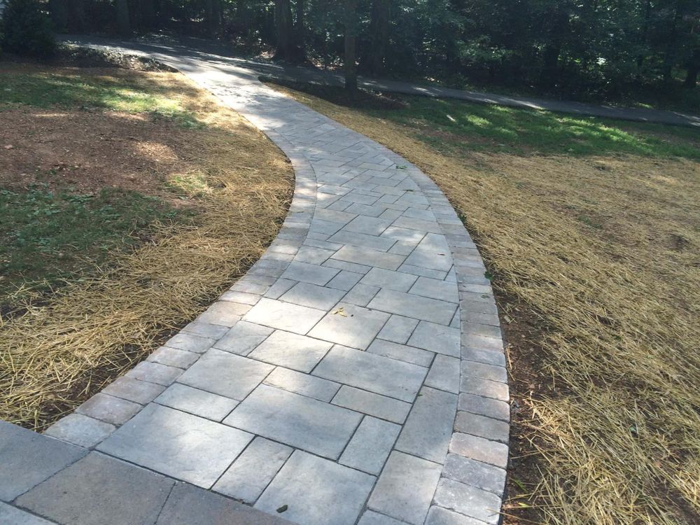 Our Walkways service offers expert installation of beautiful and functional walkways to enhance the aesthetics and usability of your outdoor space, providing safe passage while adding value to your property. for Denicola’s Lawn Care in Oxbow,  NY