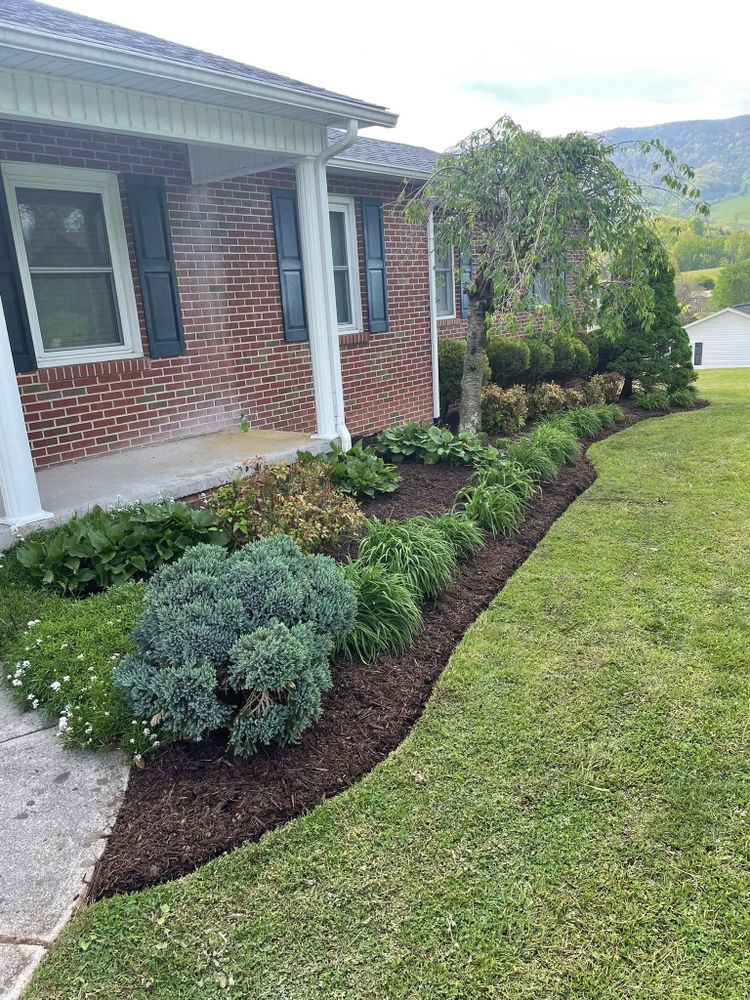 Enhance your garden's health and appearance with our professional mulch installation service, designed to maintain soil moisture, prevent weeds, and improve curb appeal using high-quality materials tailored to your landscape. for Simmons Brothers Investments in Pounding Mill, VA