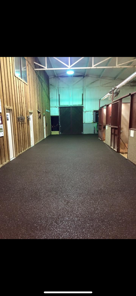 Our Barn Aisle Flooring service provides durable, safe, and easy-to-clean flooring options for horse barns. Choose from a variety of materials that are designed to withstand heavy use and provide comfort for your horses. for Shelton Trailer Flooring  in Ocala, FL