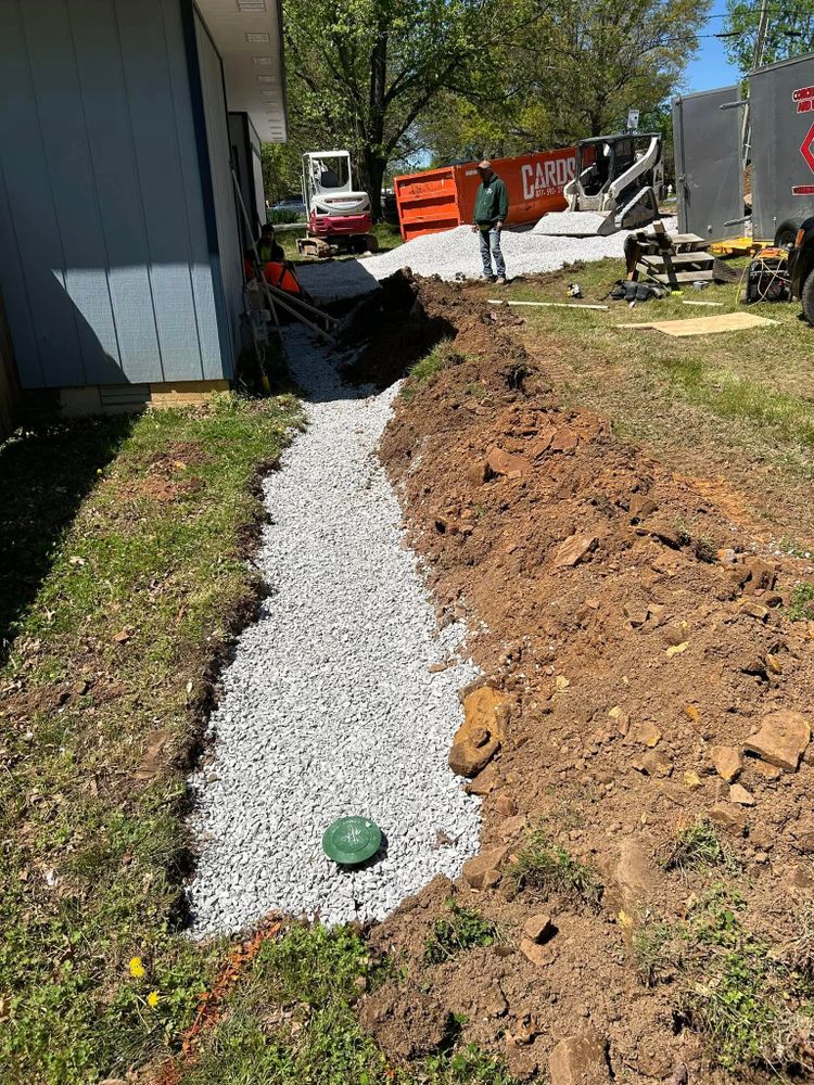 Our French Drains service effectively manages water drainage around your home, preventing foundation damage and landscape flooding by redirecting water away from your property through strategically installed underground piping. for Concrete Creations and Excavations in Centerton, AR