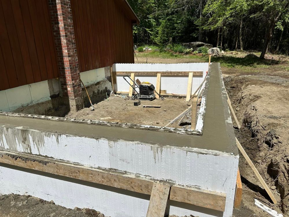 Our Foundation Digging service ensures precise, efficient excavation for your home project, laying a solid groundwork with modern equipment and skilled professionals to guarantee stability and safety for your construction needs. for TBC Custom Trades in West Burke, VT