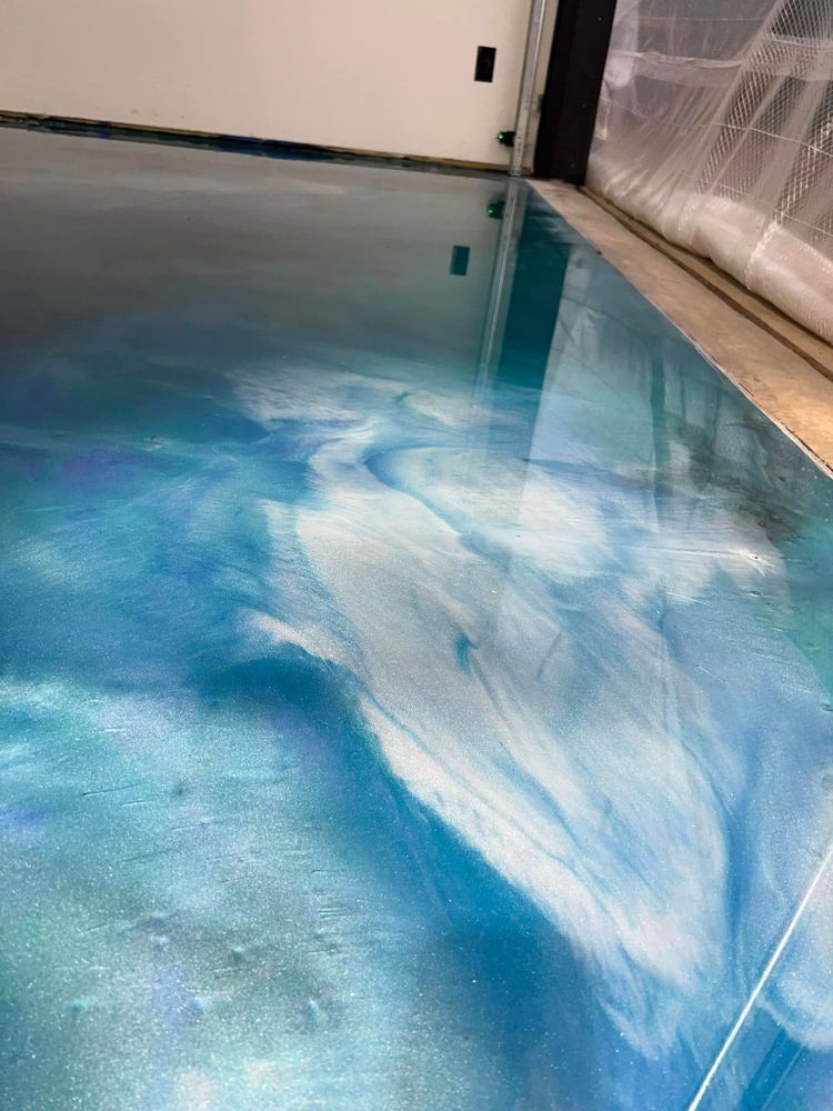 Enhance your home's aesthetic with our Metallic Epoxy service, offering durable and stunning high-gloss finishes. Transform floors into eye-catching surfaces with customizable colors that reflect light beautifully, ensuring both style and longevity. for Advanced Coating Solutions in Wittenberg, WI
