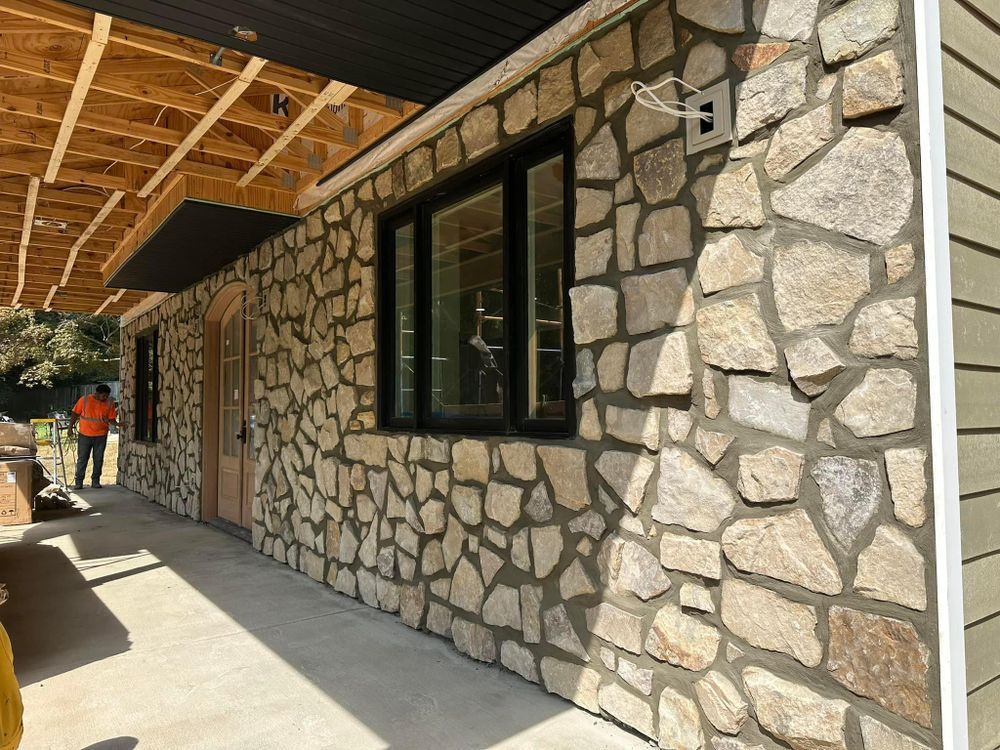 Enhance your home's aesthetic appeal with our expert Exterior Stone Veneer service, transforming the exterior into a beautiful and durable showcase of elegance and sophistication. for Matteo Hardscapes in Towson,  MD