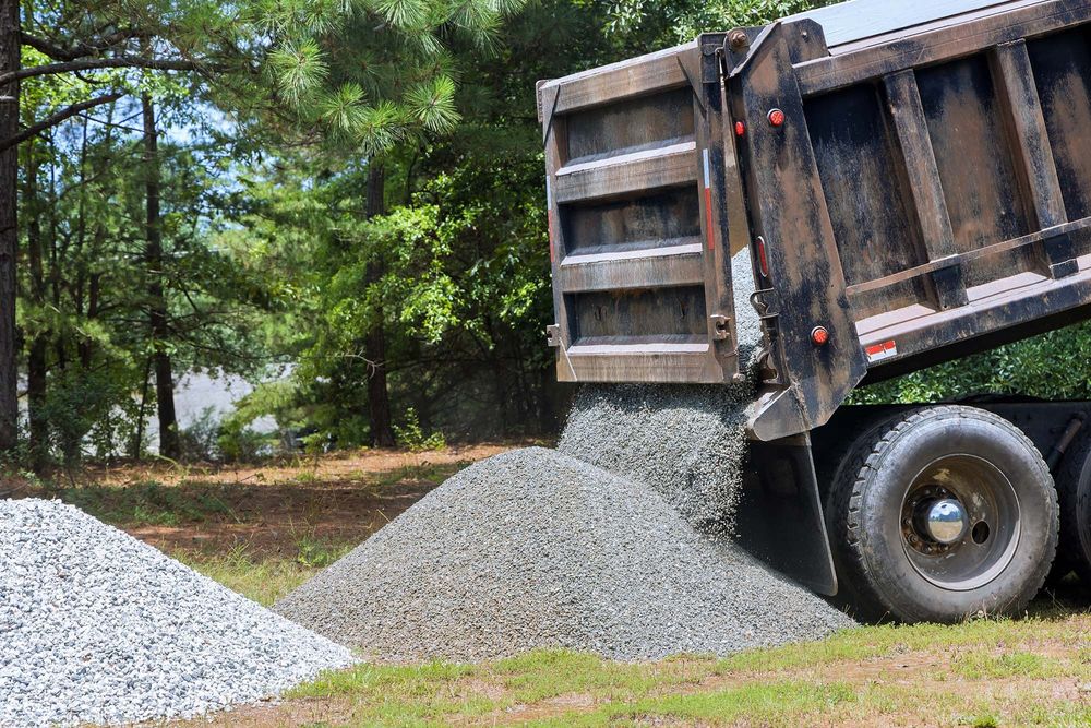 Our dump truck services provide efficient hauling and removal for your excavation projects, while our local expertise ensures seamless integration with related tasks like "tree services near me" to simplify your landscaping needs. for Old South Grading in Glade Valley, NC