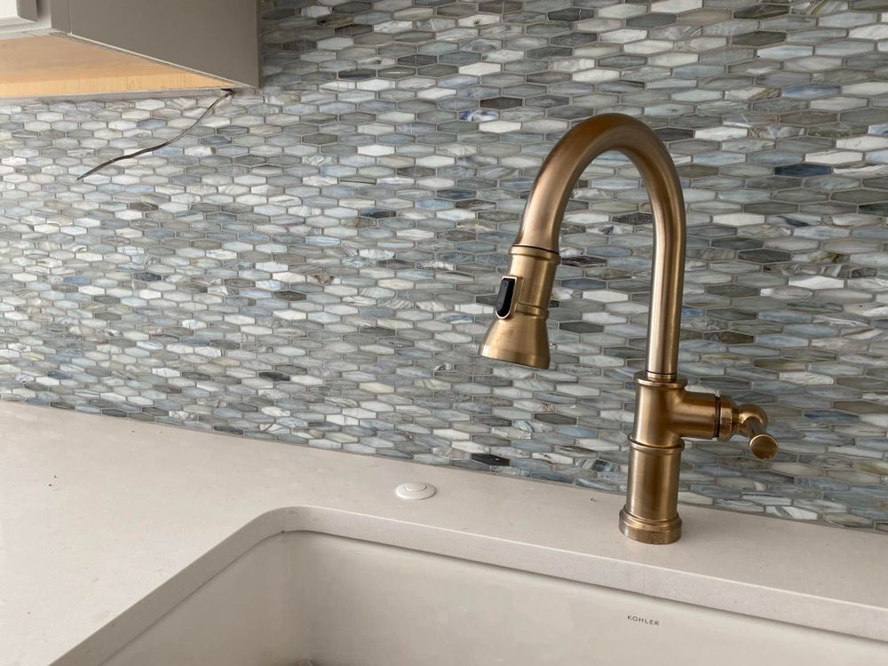 Transform your kitchen or bathroom with our expert backsplash installation service, offering precision craftsmanship and a wide selection of stunning tile designs to enhance your home's aesthetic and functionality. for Northern Tile in Richmond, MI