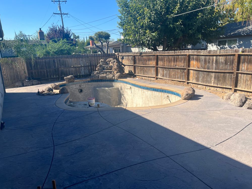 Enhance your outdoor space with our durable and stylish pool decks, expertly crafted to withstand the elements while providing a safe and attractive area for relaxation and entertainment. for PREMIER CONCRETE CREATIONS in Stockton, CA