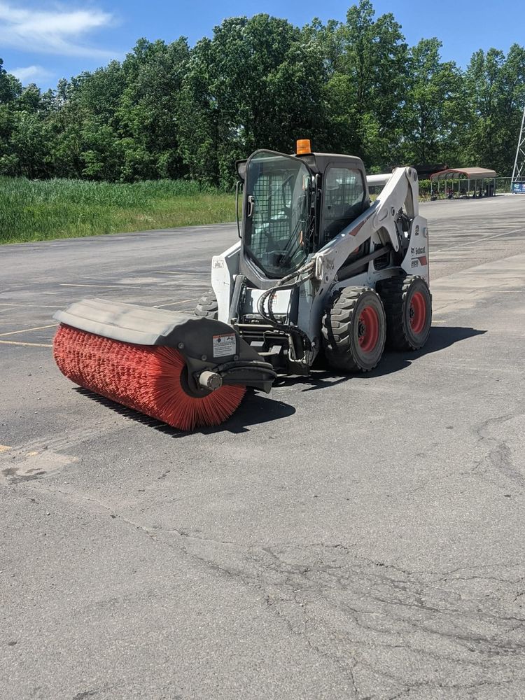 Our Parking Lot Sweeping service ensures a clean and safe environment, enhancing visibility with commercial parking lot lights. Trust our concrete experts to maintain your space impeccably for improved aesthetics and safety. for Henceroth Construction in Amherst, OH