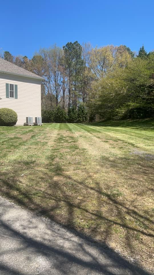 Enhance your home's curb appeal with our professional lawn seeding service, ensuring lush, green grass by filling bare patches and improving overall thickness for a stunning and healthy landscape. for Morris Contracting in Leonardtown, MD