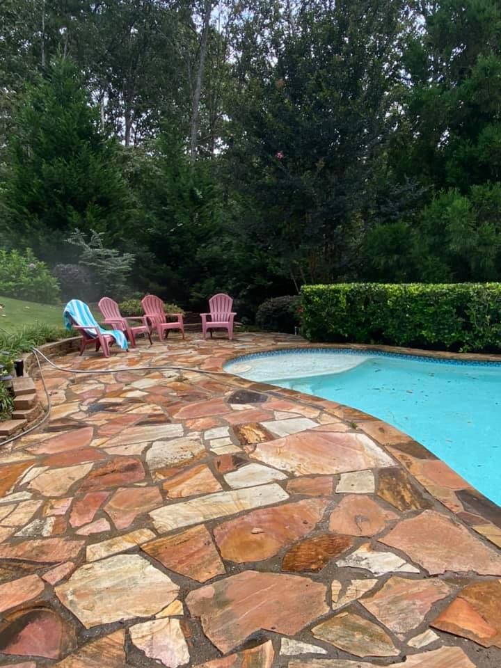 Our Hardscape Cleaning service is perfect for homeowners who want to clean their patio, driveway, and other hardscape surfaces. We use a pressure washer to clean the surfaces, and then we use a soft wash to remove any remaining dirt or debris. for H2Whoa Pressure Washing, Gutter Cleaning, Window Cleaning in Cumming, GA