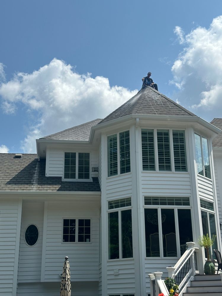 Our professional roof cleaning service effectively removes dirt, moss, and algae from your roof to restore its appearance and extend its lifespan, enhancing the overall curb appeal of your home. for Soapy Suds Services in St. Charles, IL