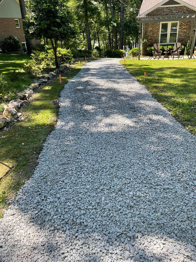 Our Driveway Repairs and Gravel Work service is perfect for homeowners who need their driveway fixed or gravel added. We can help you with any repair or installation needs you may have! for Greenwood Lawn & Landscaping LLC in Talladega, Alabama