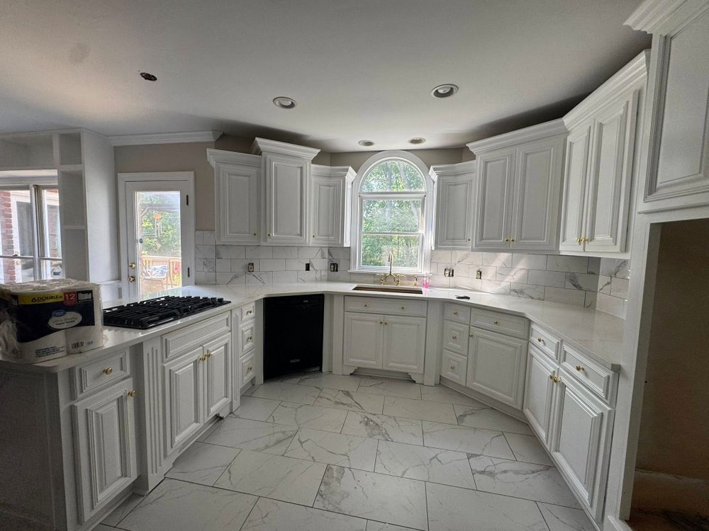 Enhance your kitchen's appeal with our expert cabinet refinishing, offering a cost-effective makeover that revitalizes surfaces with fresh finishes and vibrant colors, significantly increasing both beauty and home value. for JJR Painting in Kannapolis, NC