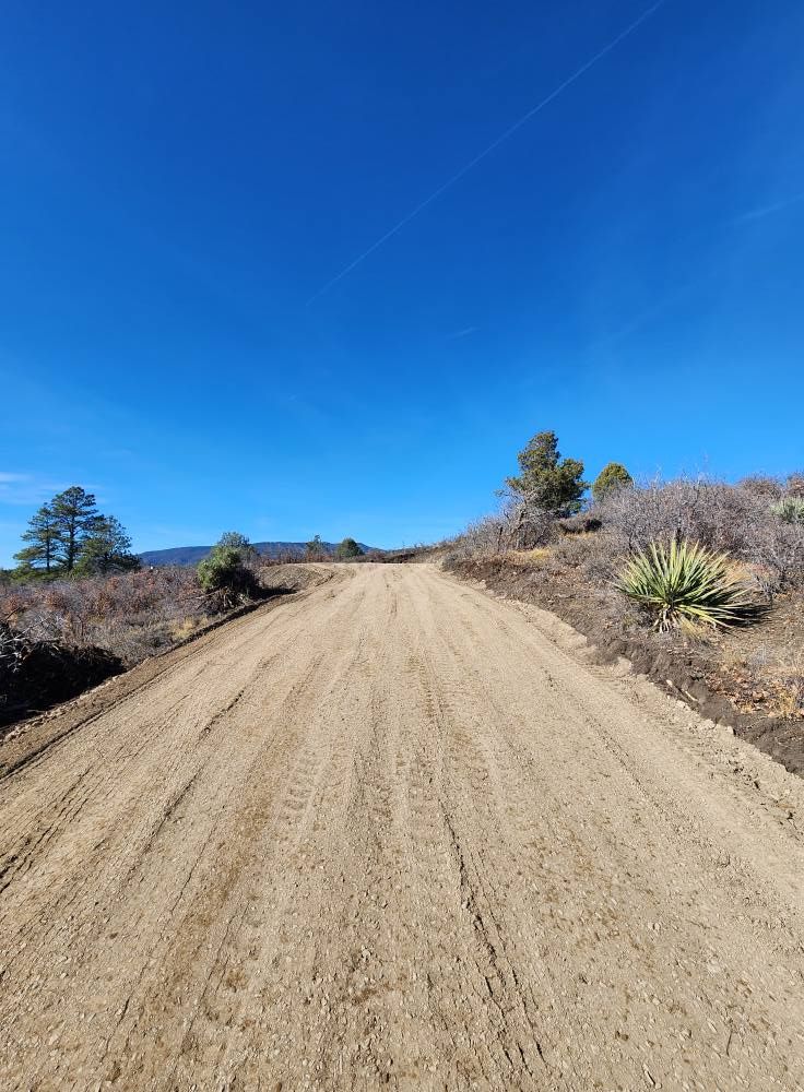 Our Land Grading service ensures your property is level and properly sloped for optimal drainage, preventing erosion and enhancing stability, making it an ideal foundation for landscaping or construction projects. for Markham Septic & Excavation in Pagosa Springs, CO