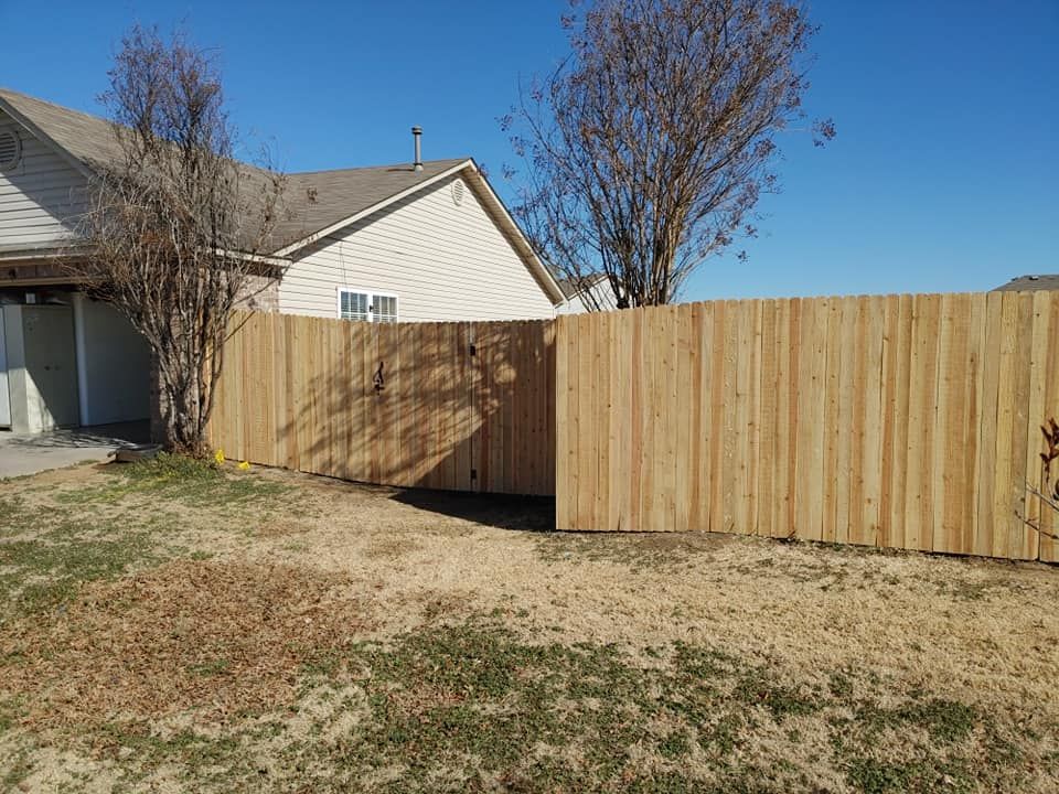 Enhance your home's security and aesthetics with our professional gate installation service, offering customized solutions, expert craftsmanship, and durable materials to perfectly complement your existing fence design. for Kalos Decks and Fences  in Bixby, OK