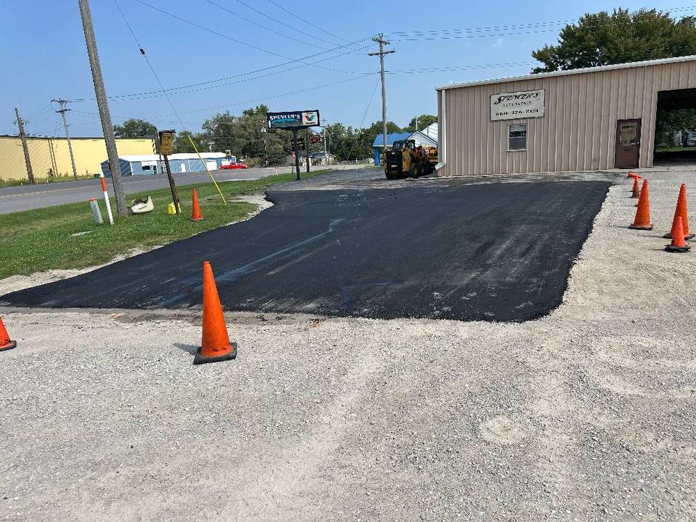 Our Asphalt Driveway Installation service ensures a durable, smooth surface that enhances curb appeal and withstands weather conditions, using high-quality materials and expert techniques for long-lasting performance tailored to your home's needs. for Bishop Asphalt Sealcoating in Marceline, MO