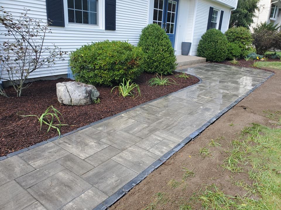 Our Shrub Trimming service enhances your garden's beauty by expertly shaping and maintaining shrubs, improving plant health and curb appeal while ensuring a neat, vibrant landscape all year round. for Evolution Earthscapes, LLC in Ludlow, MA