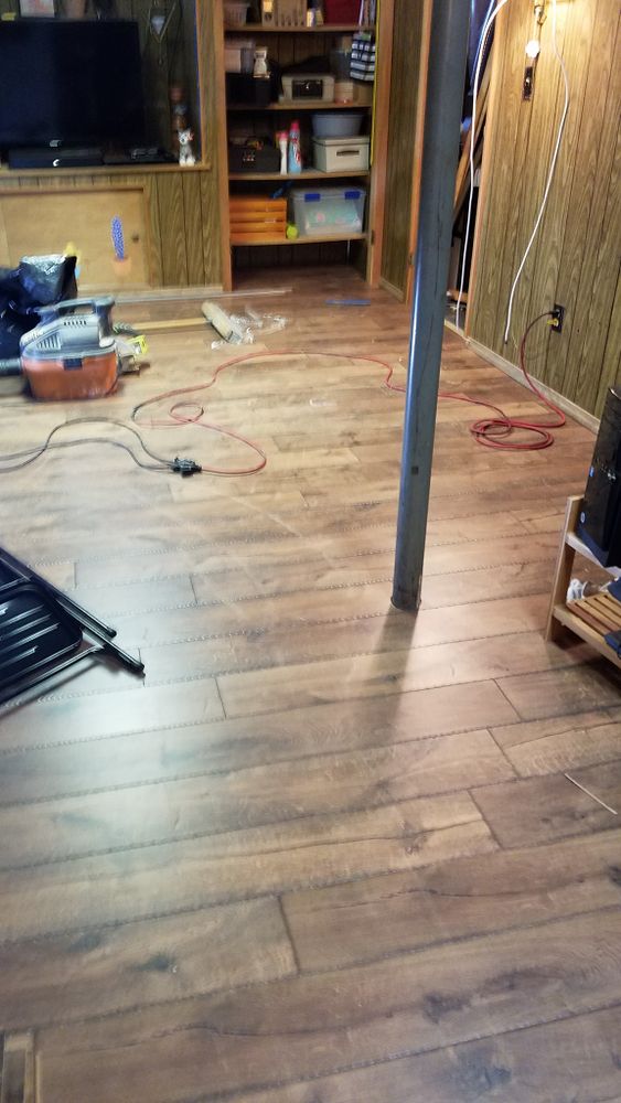 Enhance your home's elegance with our LPV Flooring service, offering durable and stylish wood flooring options that mimic natural wood's beauty, providing a cost-effective and easy-to-maintain solution for any space. for American Floor Pros LLC in Fenton, MO