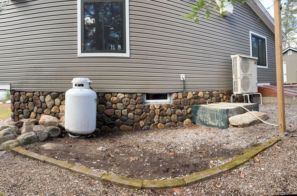 Our Retaining Wall Construction service expertly designs and builds durable, aesthetically pleasing retaining walls to enhance your landscape’s functionality and beauty while preventing soil erosion on your property. for Smythe’s Stonework & Masonry in Buxton, ME