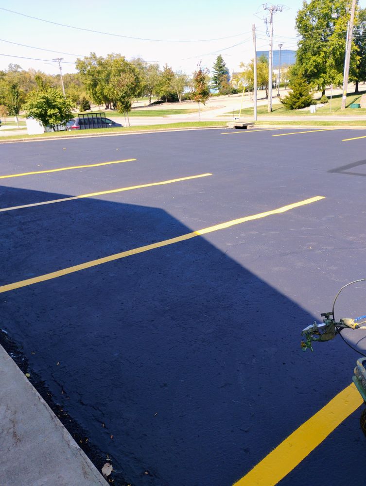 Enhance your driveway's appearance and safety with our professional striping service, providing clear, precise lines for better organization and improved curb appeal. Perfect for both new installations and refreshing existing layouts. for Bishop Asphalt Sealcoating in Marceline, MO