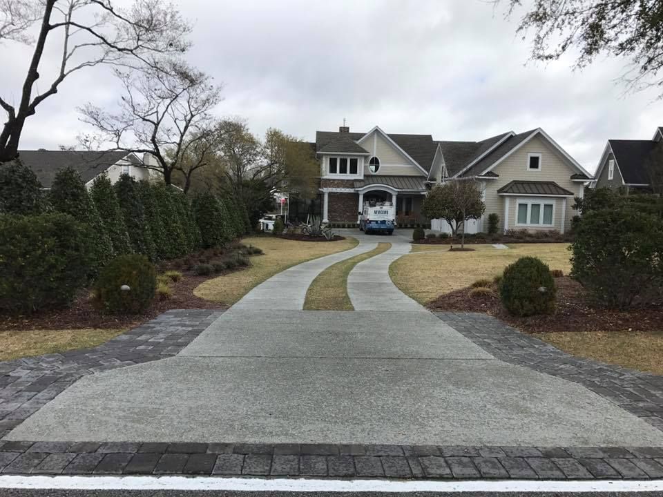 Transform your home's curb appeal with our expert driveway construction services, offering durable and stylish concrete solutions tailored to your needs for a functional and visually appealing entrance. for Rock Solid Custom Concrete in Wilmington, NC