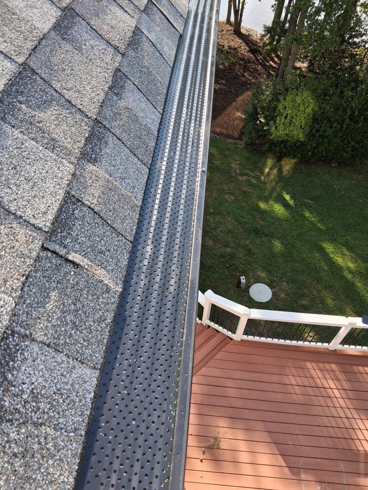 Our Gutter Maintenance service ensures your gutters are clean and free-flowing, protecting your home from water damage, preventing clogs, and extending the lifespan of your gutter system through expert care. for Platinum Peak Construction in Wilkes County, NC
