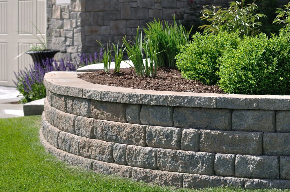 Enhance your property's landscape with our expert retaining wall services. Our skilled team designs and constructs durable, attractive walls that prevent soil erosion while adding aesthetic appeal to your outdoor spaces. for J&M Stump Grinders LLC in Douglasville, GA