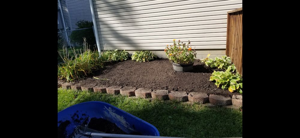 Enhance your outdoor living space with our professional landscaping service, transforming your backyard into a tranquil oasis with lush greenery, beautiful hardscaping, colorful flowers, and soothing water features. for Precision Paving and Sealing LLC  in Waterford Township,  MI