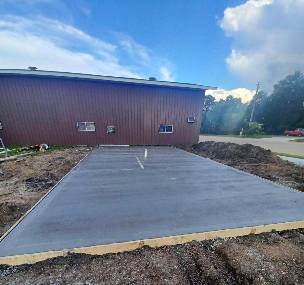 Enhance your home's curb appeal with our expert driveway services, offering durable and stylish concrete solutions tailored to your needs. Our skilled team ensures quality craftsmanship for a long-lasting, flawless finish. for Golden Construction in West Fargo, ND