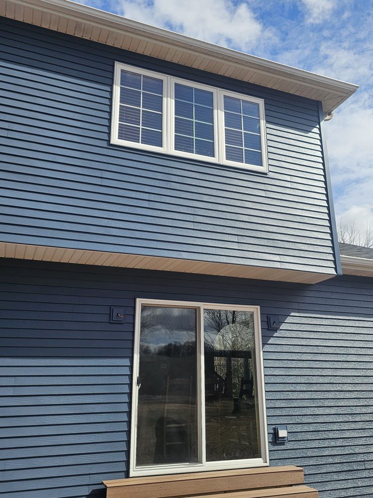 Enhance your home's appeal with our expert window installation services, perfectly complementing our deck & patio installation. Enjoy energy efficiency, durability, and aesthetic charm tailored to meet all your remodeling needs. for Omega Construction LLC in Rochester, MN