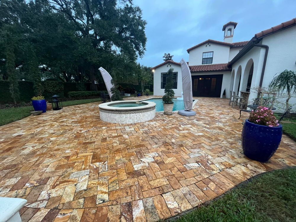 Enhance your home's curb appeal with our expert pressure washing services, ensuring your surfaces are spotless and perfectly complement your patio design & construction for a pristine outdoor environment. for Fix It Manny in Clermont, FL