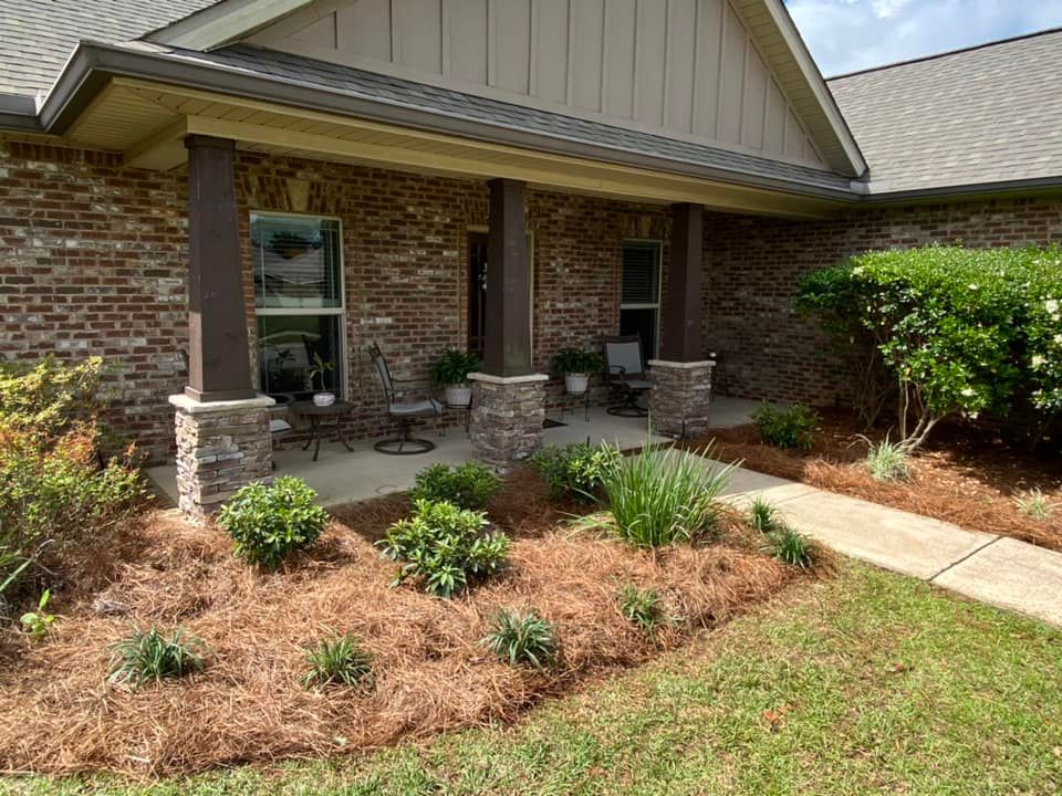 Our Mulch Installation service efficiently and professionally enhances the beauty of your lawn by providing a protective layer while preserving moisture, insulating plants, suppressing weed growth, and improving soil quality. for Grasshopper's Lawn and Landscape  in fairhope, alabama