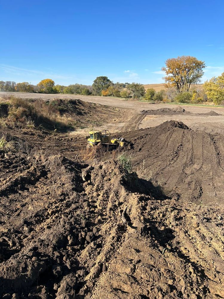 Our Leveling service ensures your land is precisely graded for construction, promoting stability and preventing drainage issues. Trust our experts to create a solid foundation for your next project. for Anthofer Dozing in Audubon, IA