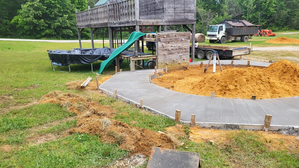 Our concrete services provide durable, aesthetically appealing driveways designed to enhance your home's curb appeal. We ensure quality craftsmanship and long-lasting results tailored to meet all your specific needs. for Huerta's Concrete Finishing in Pontotoc, MS