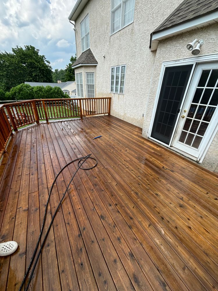 Enhance your outdoor spaces with our deck staining service. Combine expert stain application with thorough deck & patio cleaning to protect and revitalize the beauty of your wooden surfaces. for Creekside Property Solutions in Aston Township, PA