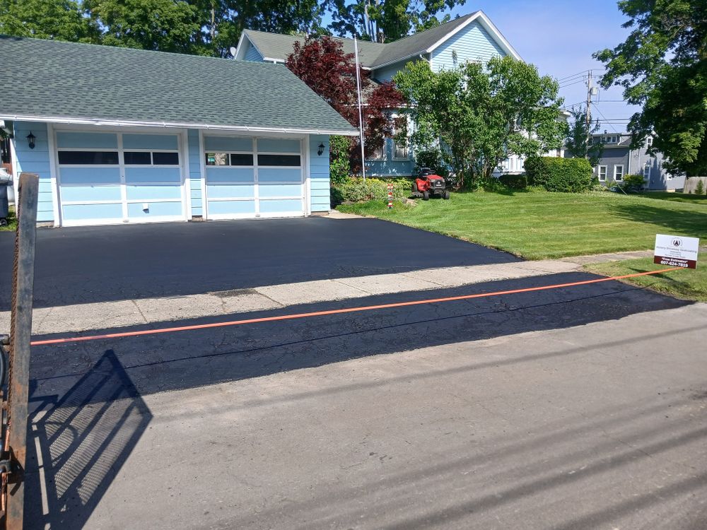 Protect and refresh your driveway with our professional sealcoating service, designed to block weather damage, resist oil stains, extend pavement life, and improve curb appeal with a smooth finish. for Victory Driveway Sealcoating in Corning, NY