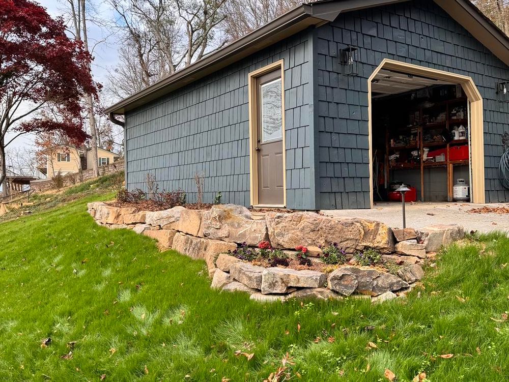 Enhance your outdoor space with our expert retaining wall construction service, providing durable and stylish solutions to prevent soil erosion while adding aesthetic appeal to your landscape. for Smoky Mountain Landscaping in Maryville, TN